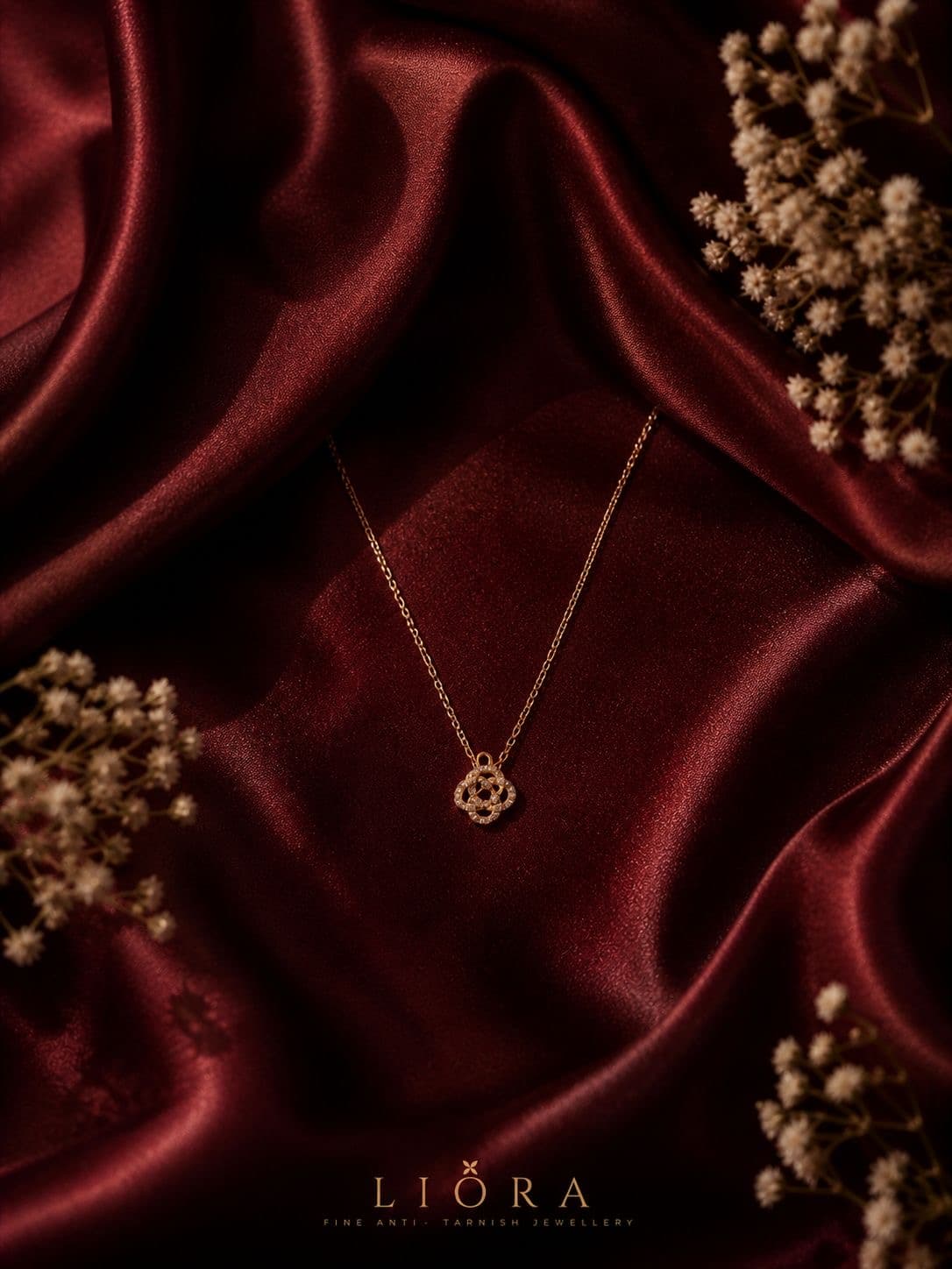 ZYRO Lumière Pendant necklace on deep burgundy silk with dried gypsophila flowers